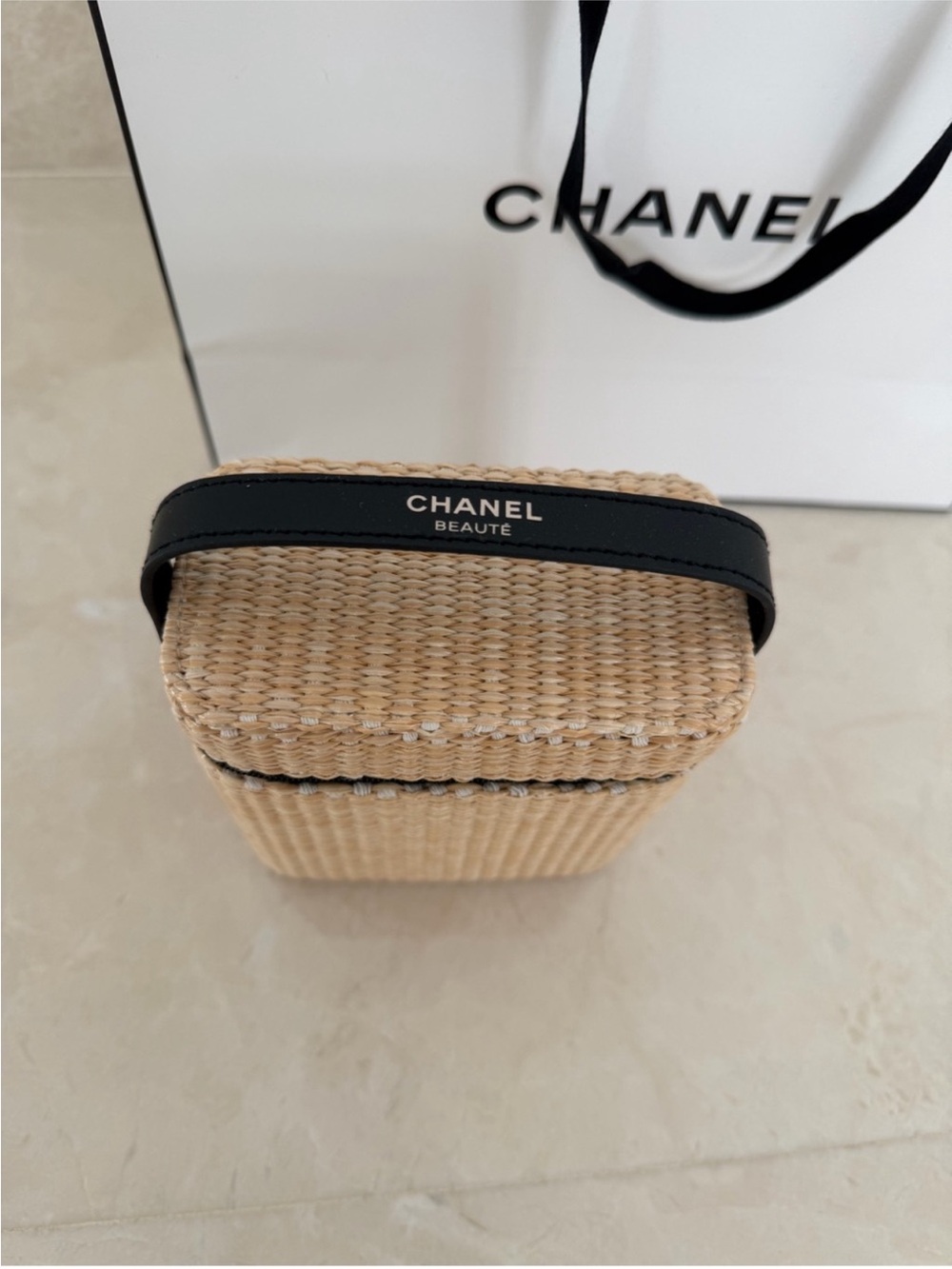 CHANEL Straw Cosmetic Case in
Natural and Black